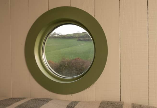 Enjoy a slow morning admiring the spellbinding view from the cosy double bed.