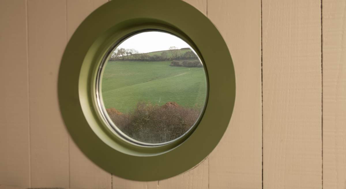 Enjoy a slow morning admiring the spellbinding view from the cosy double bed.