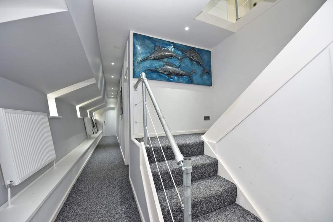 Stairs lead to the lower deck and bedrooms 2 & 3.