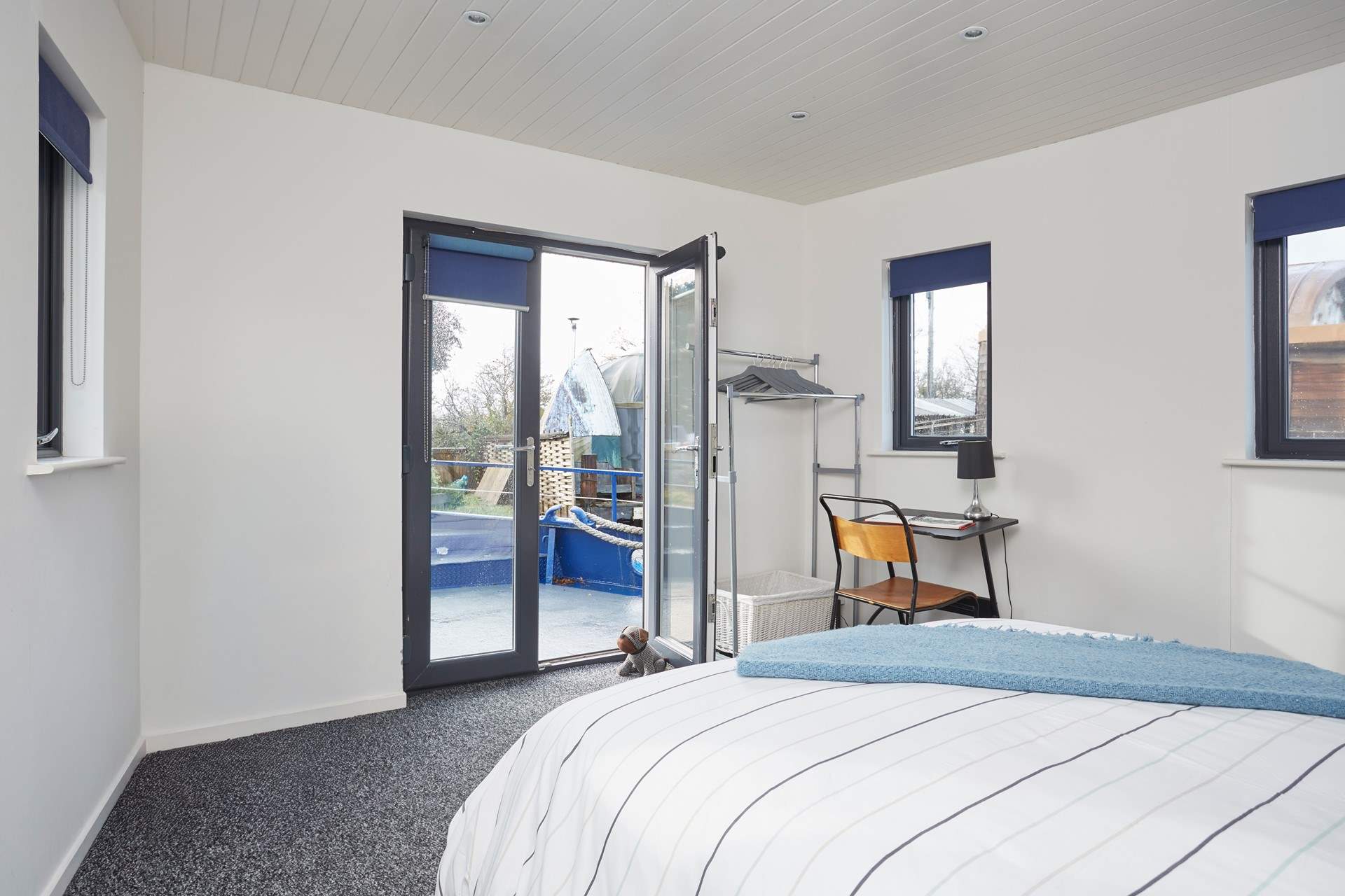 Bedroom 1 on the main deck with en suite shower-room also benefits from patio doors leading to the outer deck.