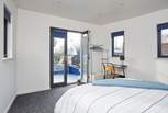 Bedroom 1 on the main deck with en suite shower-room also benefits from patio doors leading to the outer deck.