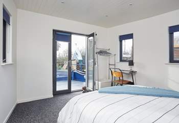 Bedroom 1 on the main deck with en suite shower-room also benefits from patio doors leading to the outer deck.