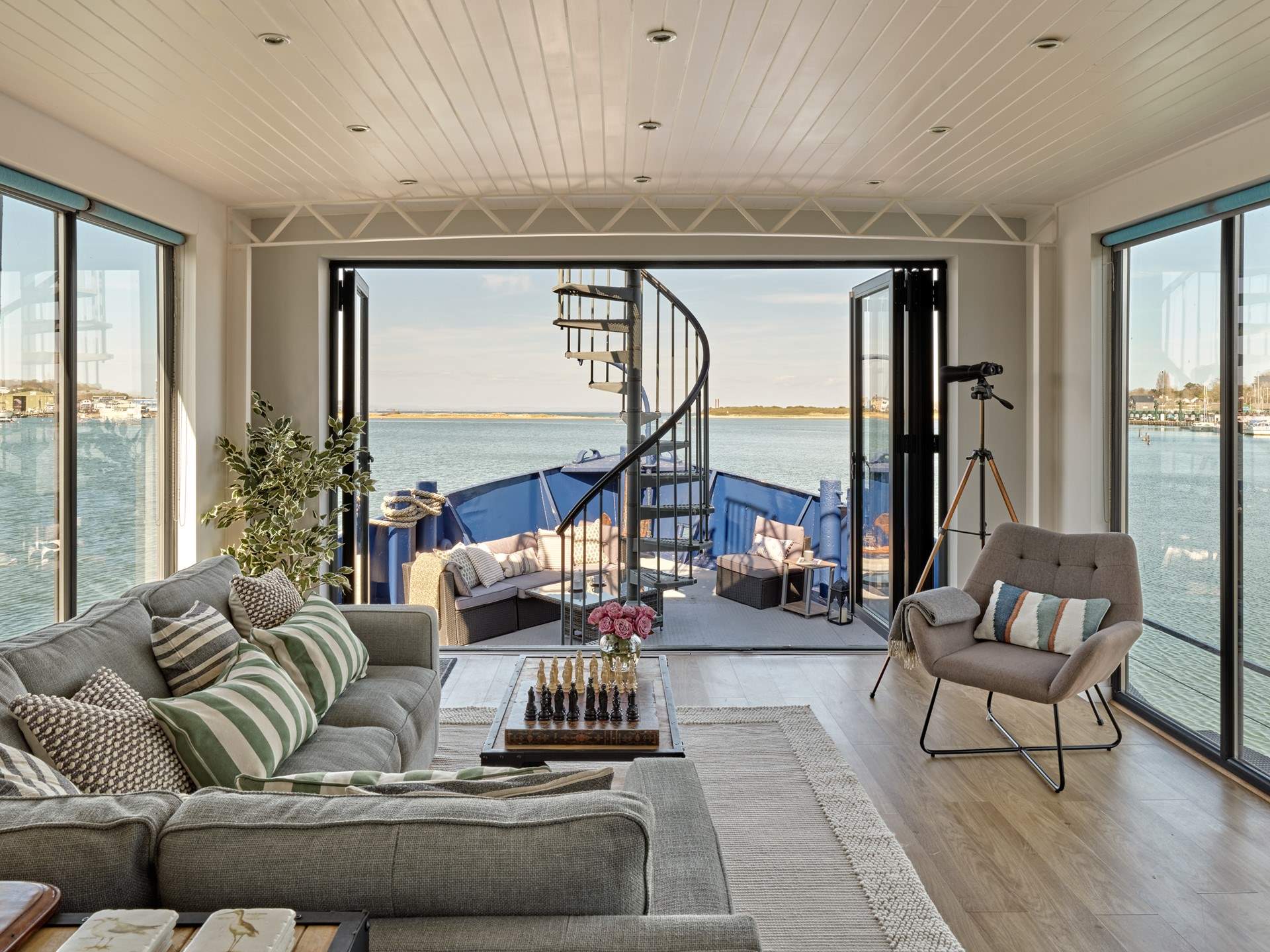 Enjoy the panoramic sea views from the living space at Newclose Houseboat.