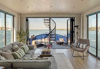 Enjoy the panoramic sea views from the living space at Newclose Houseboat.