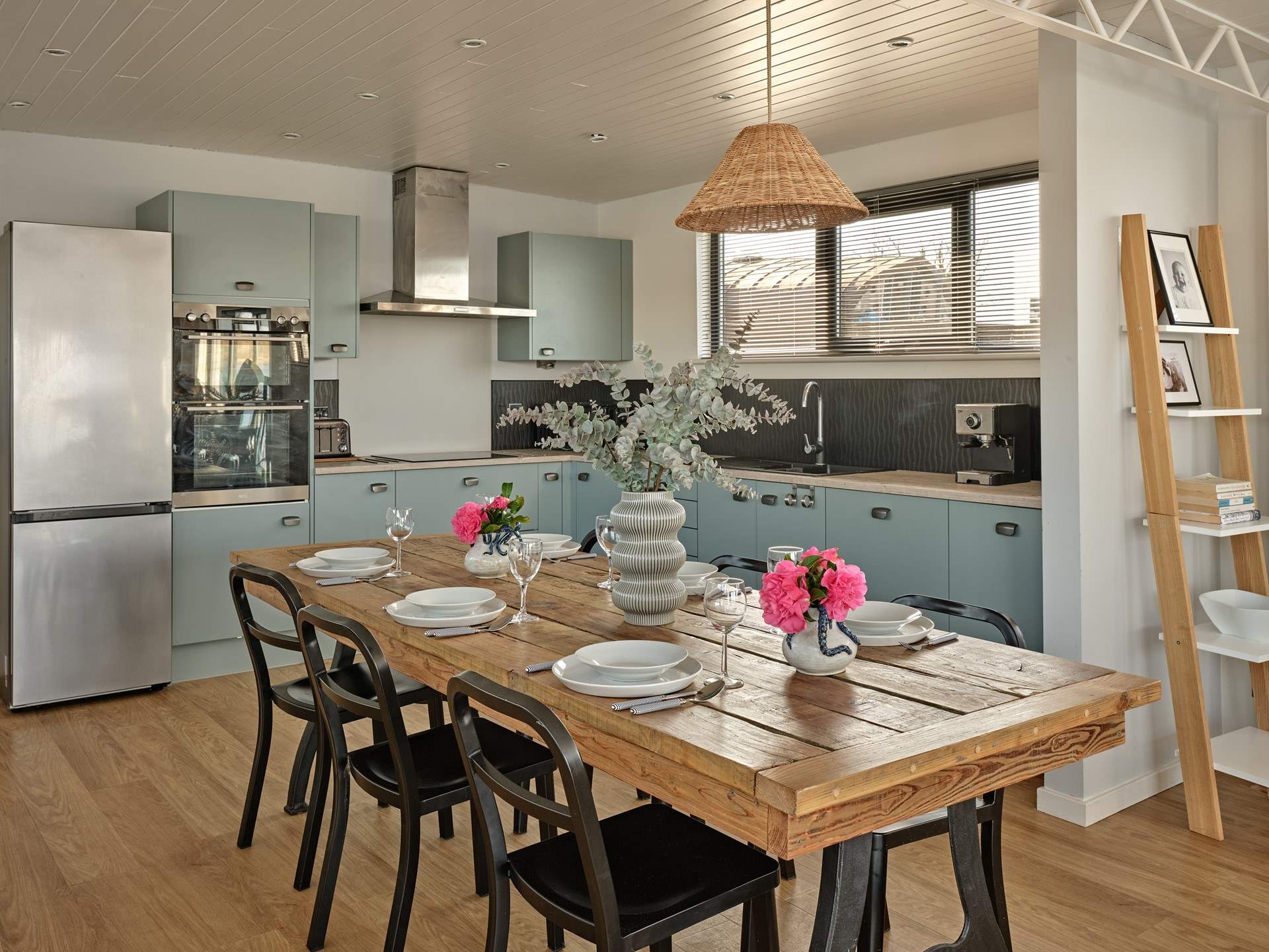 The sleek kitchen and dining space has everything you need to cook and dine all together.