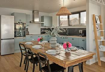 The sleek kitchen and dining space has everything you need to cook and dine all together.