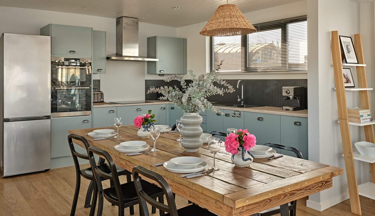 The sleek kitchen and dining space has everything you need to cook and dine all together.