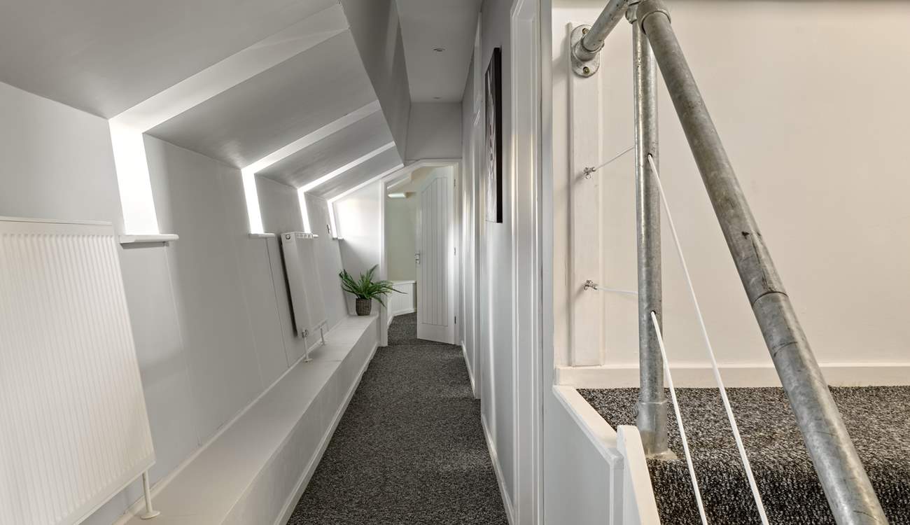 Stairs lead to the lower deck and bedrooms 2 & 3. 