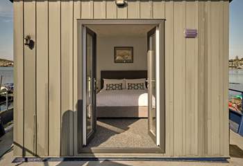 Bedroom 1 on the main deck benefits from patio doors leading to the outer deck as well as an en-suite.
