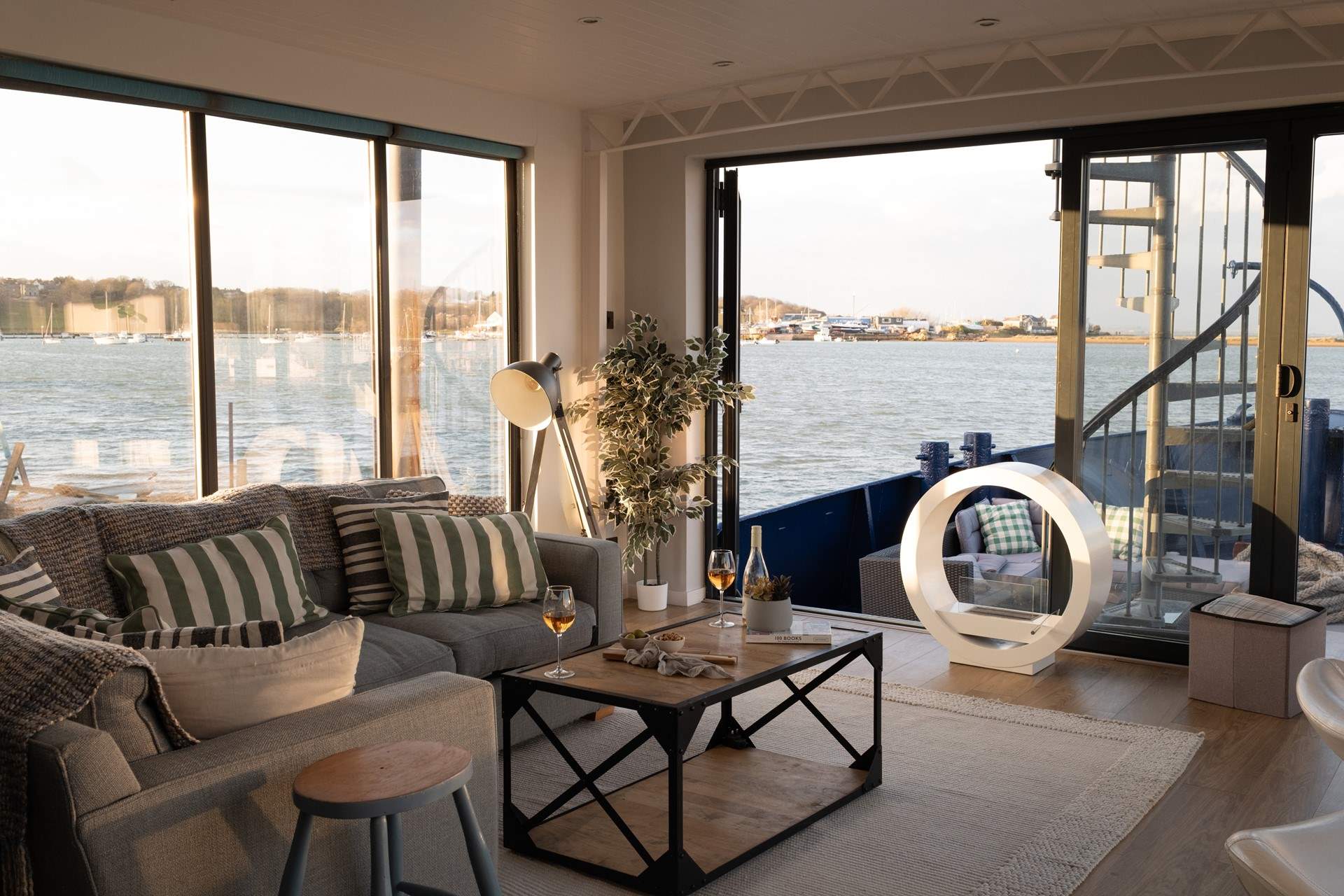 Enjoy the panoramic sea views from the living space at Newclose Houseboat.