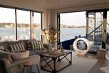 Enjoy the panoramic sea views from the living space at Newclose Houseboat.