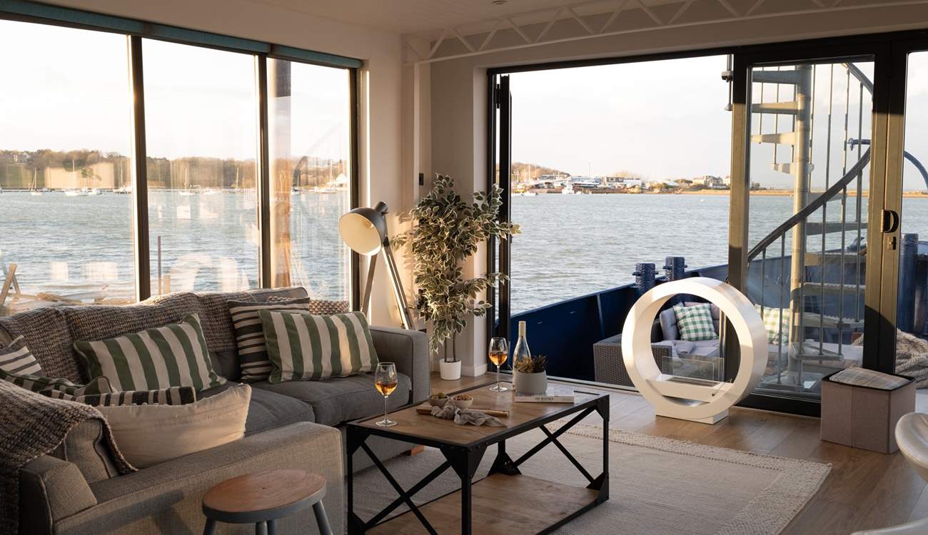 Enjoy the panoramic sea views from the living space at Newclose Houseboat.