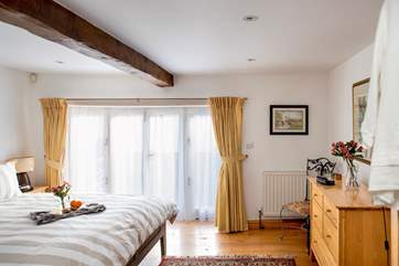 Patio doors lead out from the second bedroom to a little walled patio at the front of the cottage.