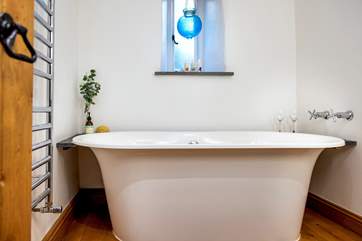 You'll enjoy a lazy holiday soak in the gorgeous bath in the family bathroom.