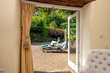 French windows lead from the lounge area out to the large terrace