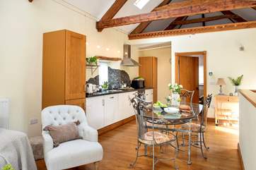 The exposed beams add to the overall character of the barn