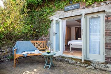 The little patio outside the bedroom is the perfect spot for morning coffee and a tasty croissant