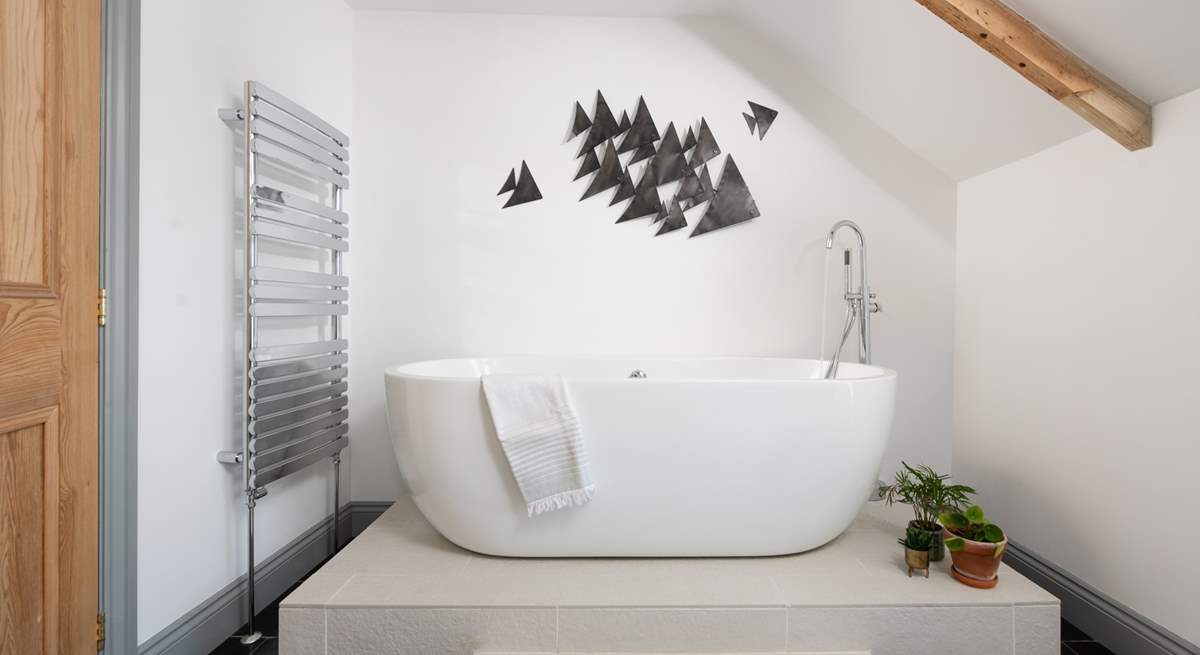 The double ended bath takes pride of place in the family bathroom...