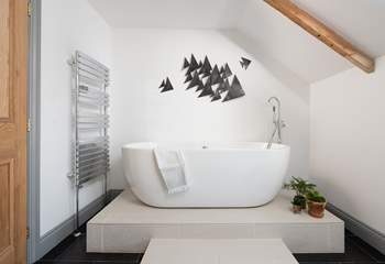 The double ended bath takes pride of place in the family bathroom...