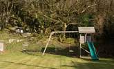 Younger members will love the swings and slide in the garden. - Thumbnail Image