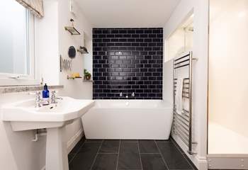 The family room has a fabulous en suite. Not only does it have a stylish double ended bath...