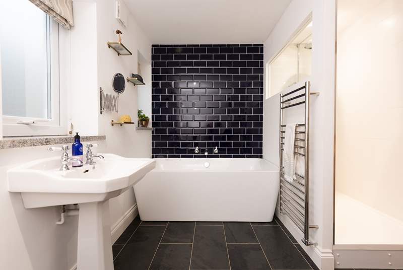 The family room has a fabulous en suite. Not only does it have a stylish double ended bath...