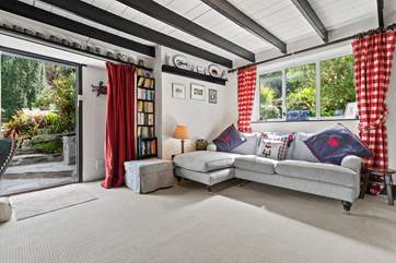 Relax on the corner sofa in front of the Smart TV.