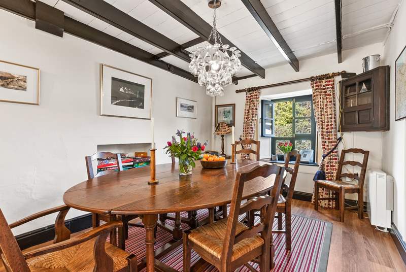 The gorgeous traditional dining area has a beautiful oak table to seat everyone.