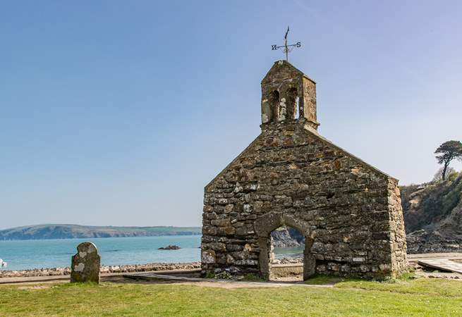 Just above the beach, the bell tower of St Brynach's church is still standing after the great storm of 1859.