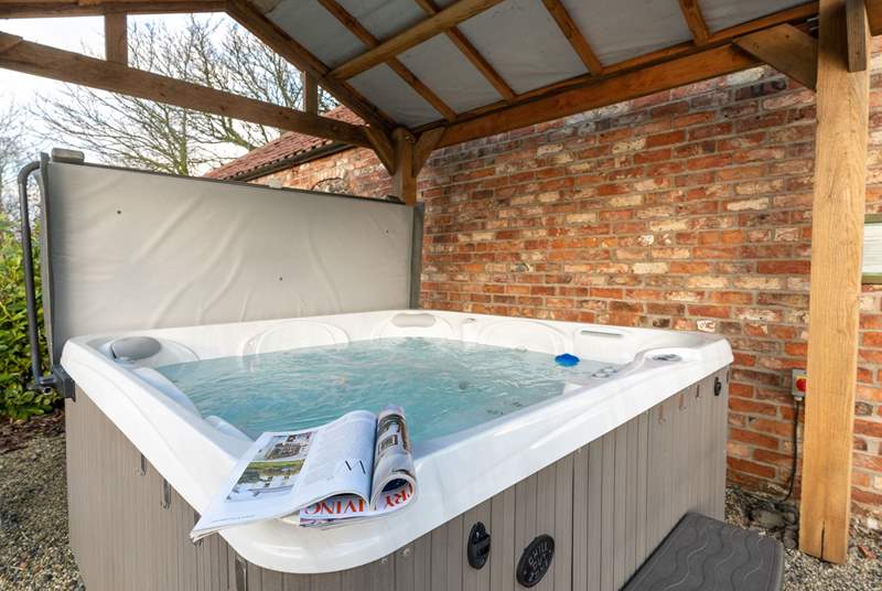 Enjoy a blissful soak in the hot tub.