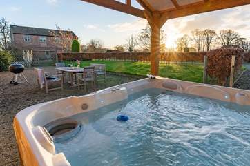 Relax in the hot tub as the sun goes down.