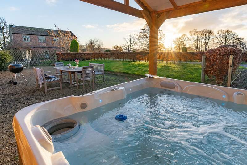 Relax in the hot tub as the sun goes down.