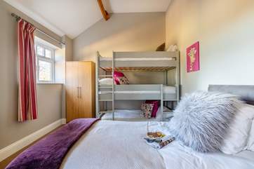 The children will love Bedroom 4 - with its triple bunk-beds and single bed.