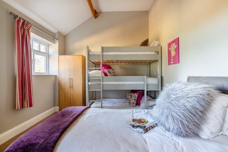 The children will love Bedroom 4 - with its triple bunk-beds and single bed.