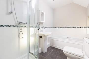 Bedroom 1 has an en suite, with a bath and a shower.