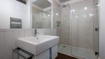 There is a downstairs shower-room with rainhead shower.