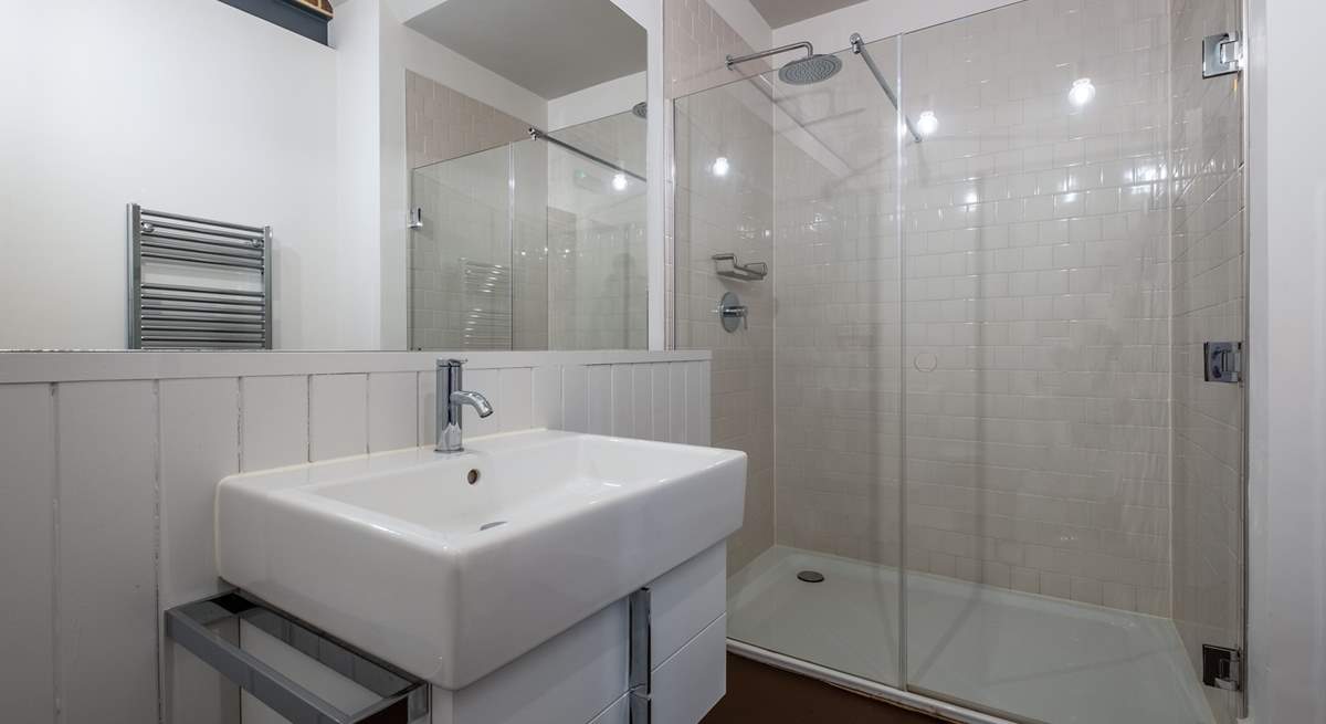 There is a downstairs shower-room with rain head shower.