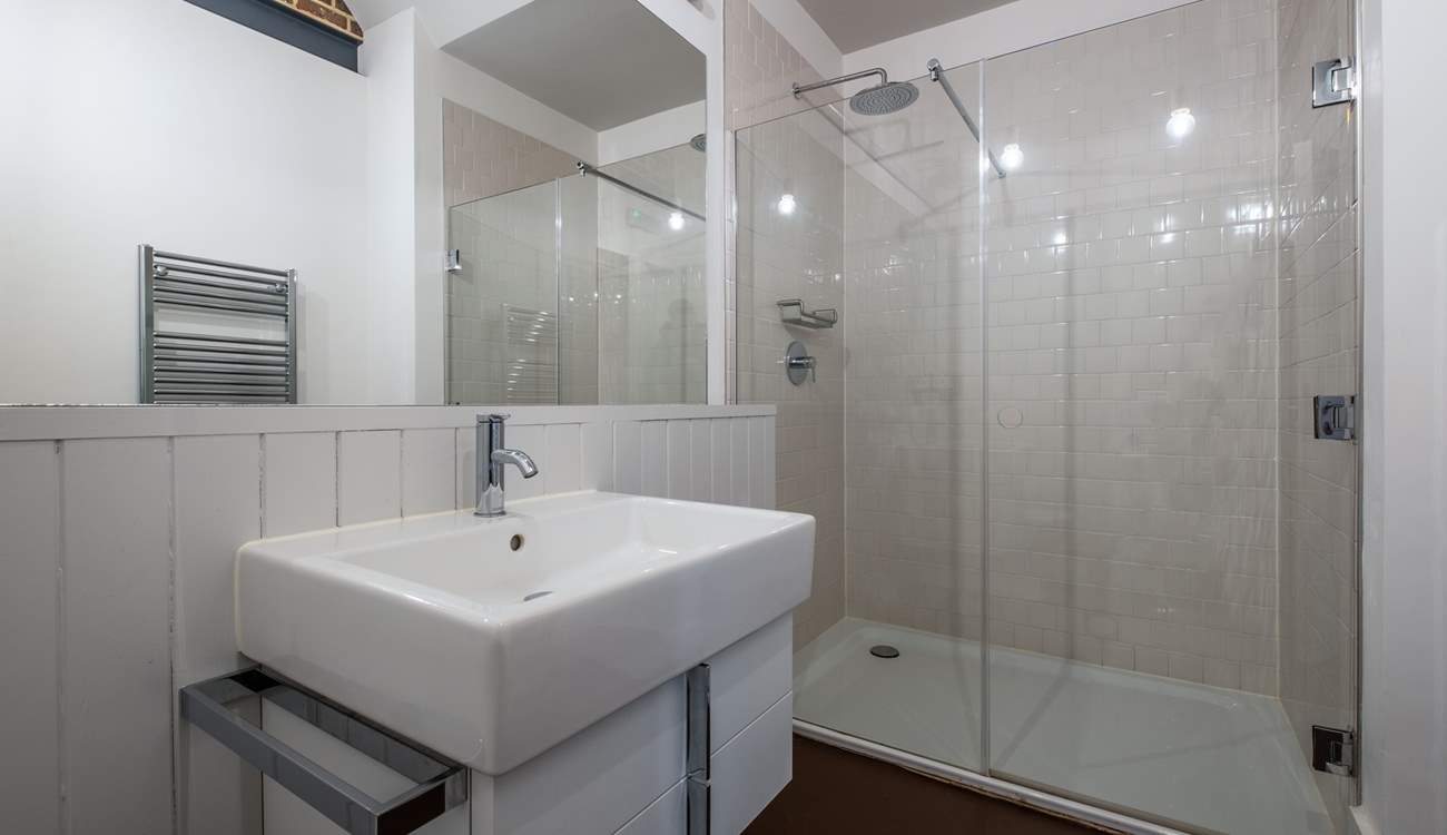 There is a downstairs shower-room with rainhead shower.