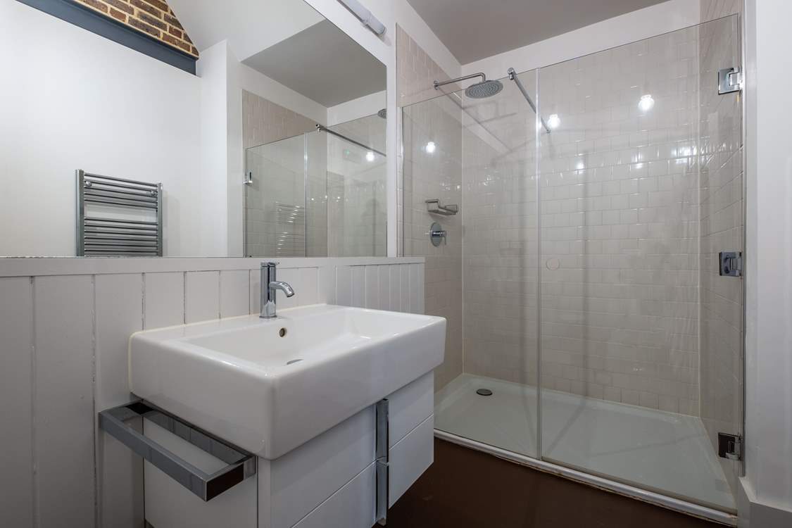 There is a downstairs shower-room with rainhead shower.