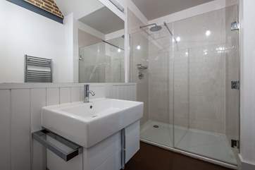 There is a downstairs shower-room with rain head shower.