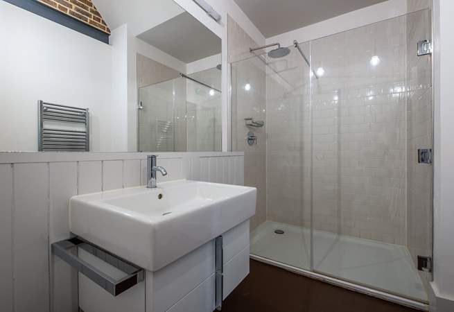 There is a downstairs shower-room with rain head shower.