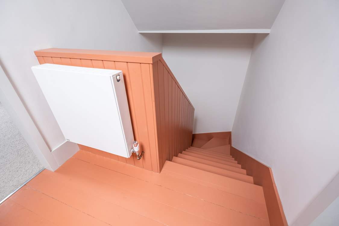 The stairs and landing which lead to the twin bedrooms.