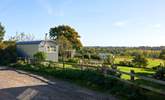 Parking is opposite the barn along side this fence which borders the neighbour's property. - Thumbnail Image