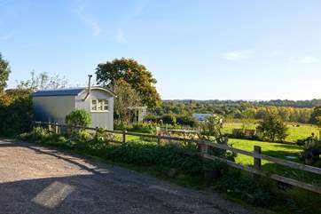 Parking is opposite the barn along side this fence which borders the neighbour's property.