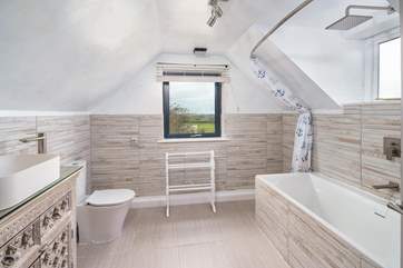 The stylish family bathroom with panoramic sea view.