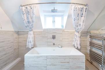 Hop in the wonderful bath tub for a luxurious soak.