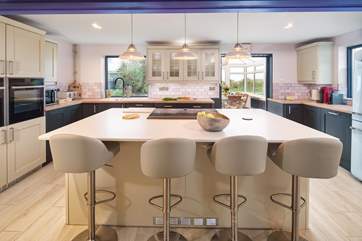 The kitchen leads through to the sunny conservatory.