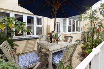 The pretty patio has a Mediterranean vibe.