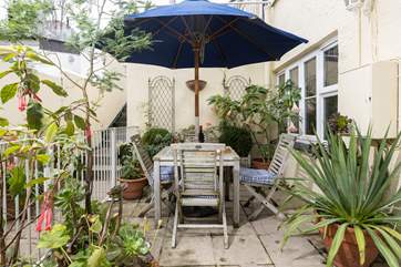 You are surrounded by Mediterranean flora and fauna on the patio.