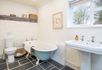 Lovely deep bath with a separate shower in the family bathroom on the lower ground floor. 